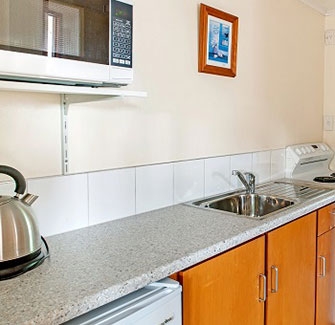 Image of a kitchen sink in a self-contained motel unit in Nelson